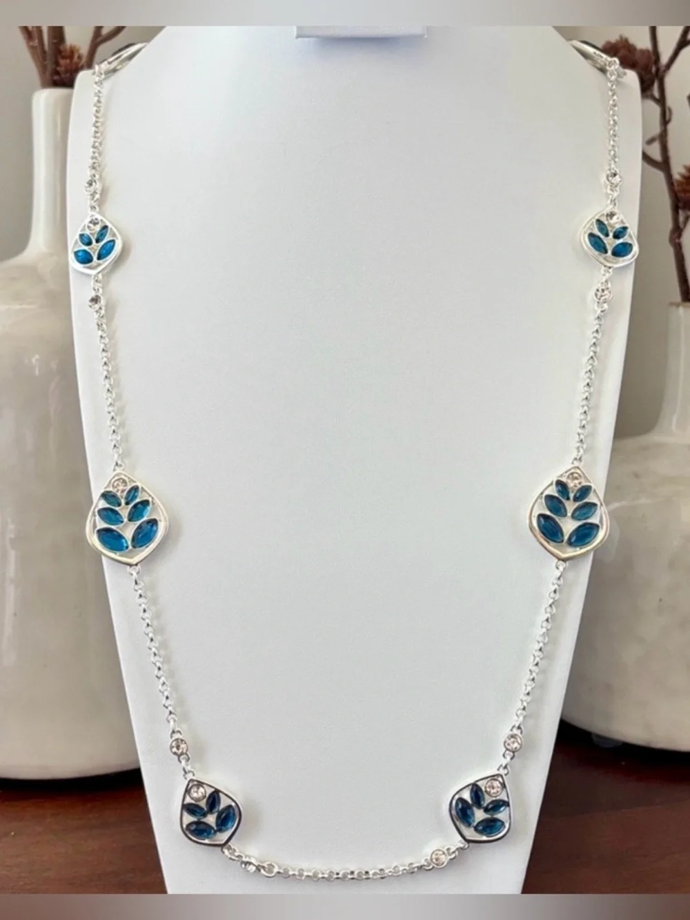Gloria Vanderbilt Reversible Silvertone chain,teardrop w/blue & clear stones